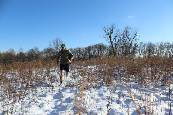 Trail runner displaying safe winter trail running technique